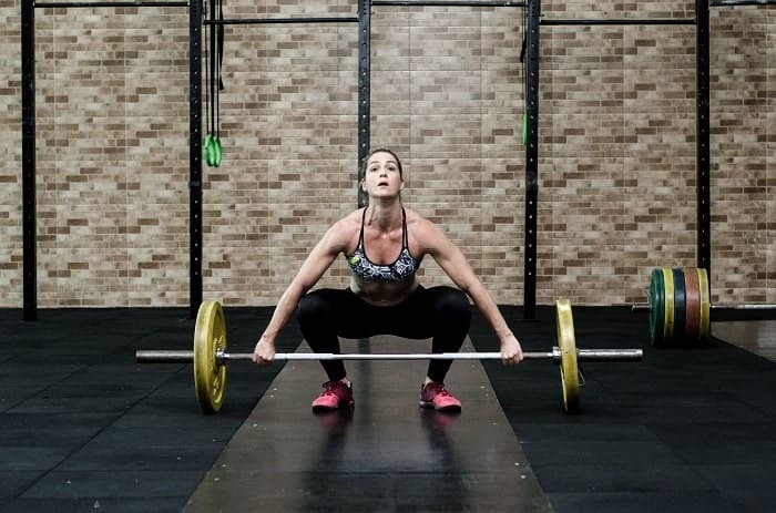 strained achilles tendon - athlete barbell