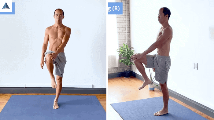 Right knee lifted and left hand pressing against it in standing dead bug variation.