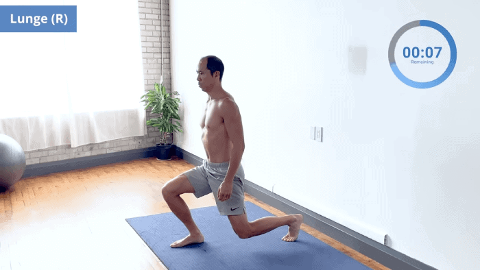 Right leg leading lunge hold with tall posture and strong lower body alignment.