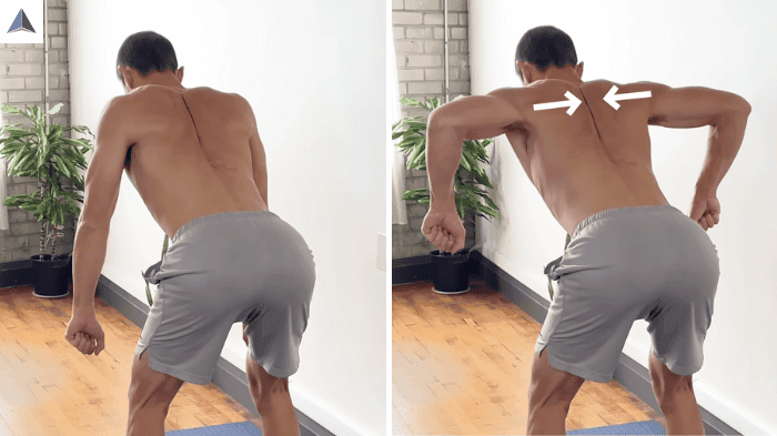 Person performing rhomboid row bent over with arms pulling toward chest